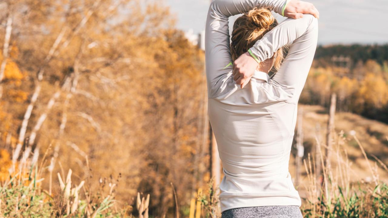 Female stretching in the outdoors