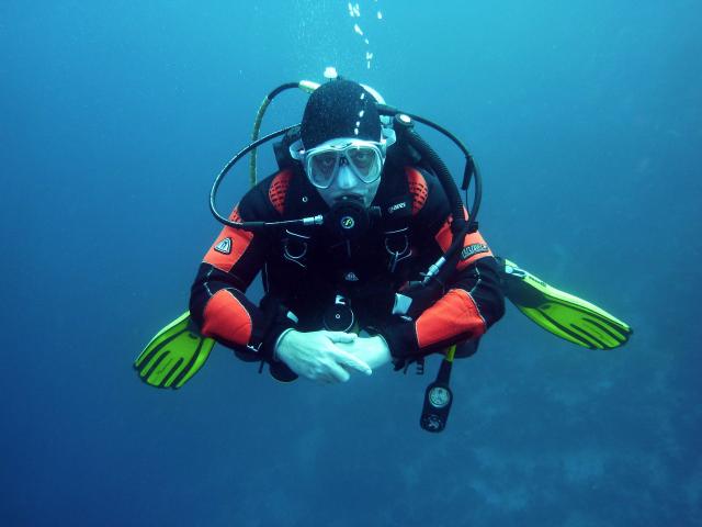 Underwater diver wearing SCUBA respirator