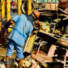 Man working in metal scrap yard