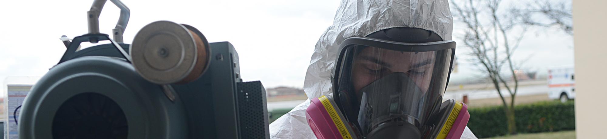 industrial employee wearing a full face respirator