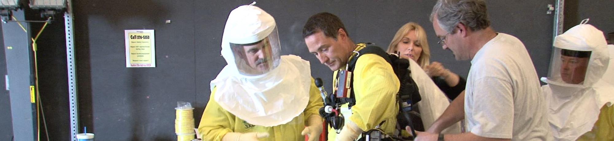 Industrial workers wearing PAPR respirators